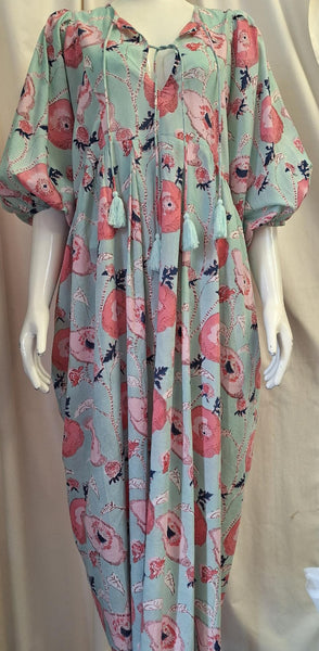 Floral dress on a mannequin against a gray background
