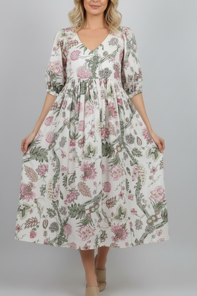 Woman wearing a floral dress on a white background