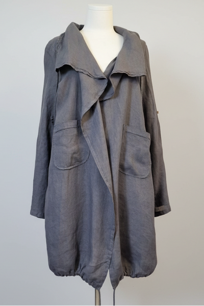 Gray coat on a mannequin against a plain background