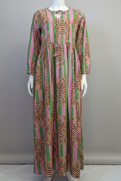 Long patterned dress on a mannequin against a plain background