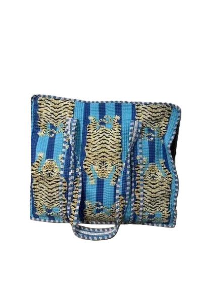 Blue and gold patterned bag on a white background