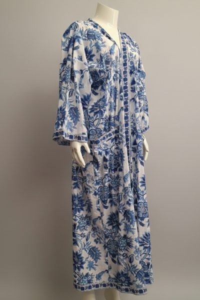 Mannequin wearing a blue floral dress against a plain background