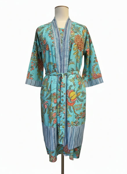 Colorful floral-patterned dress on a mannequin against a white background