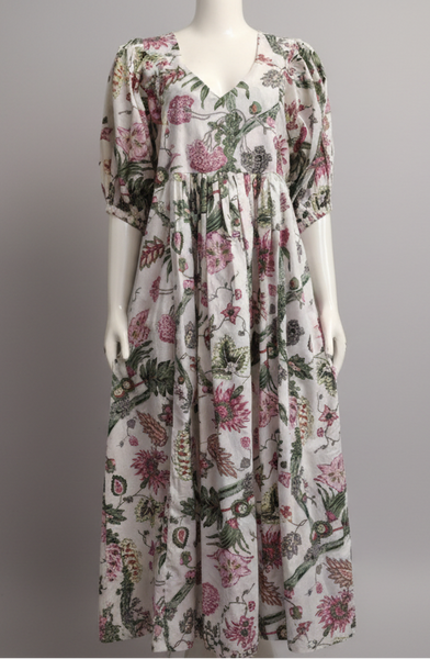 Floral dress on a mannequin against a gray background